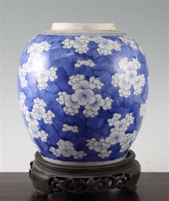 A Chinese blue and white ovoid jar, 18th century, height 21.5cm, wood stand